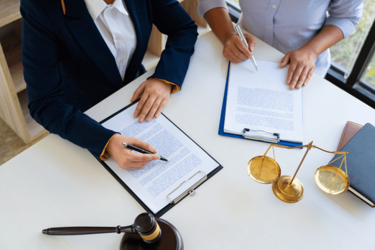Lawyer working with client on some documents